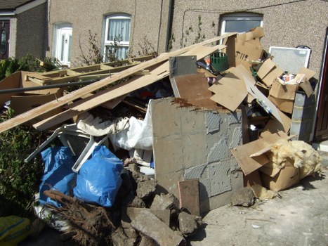 Workers managing builders waste safely